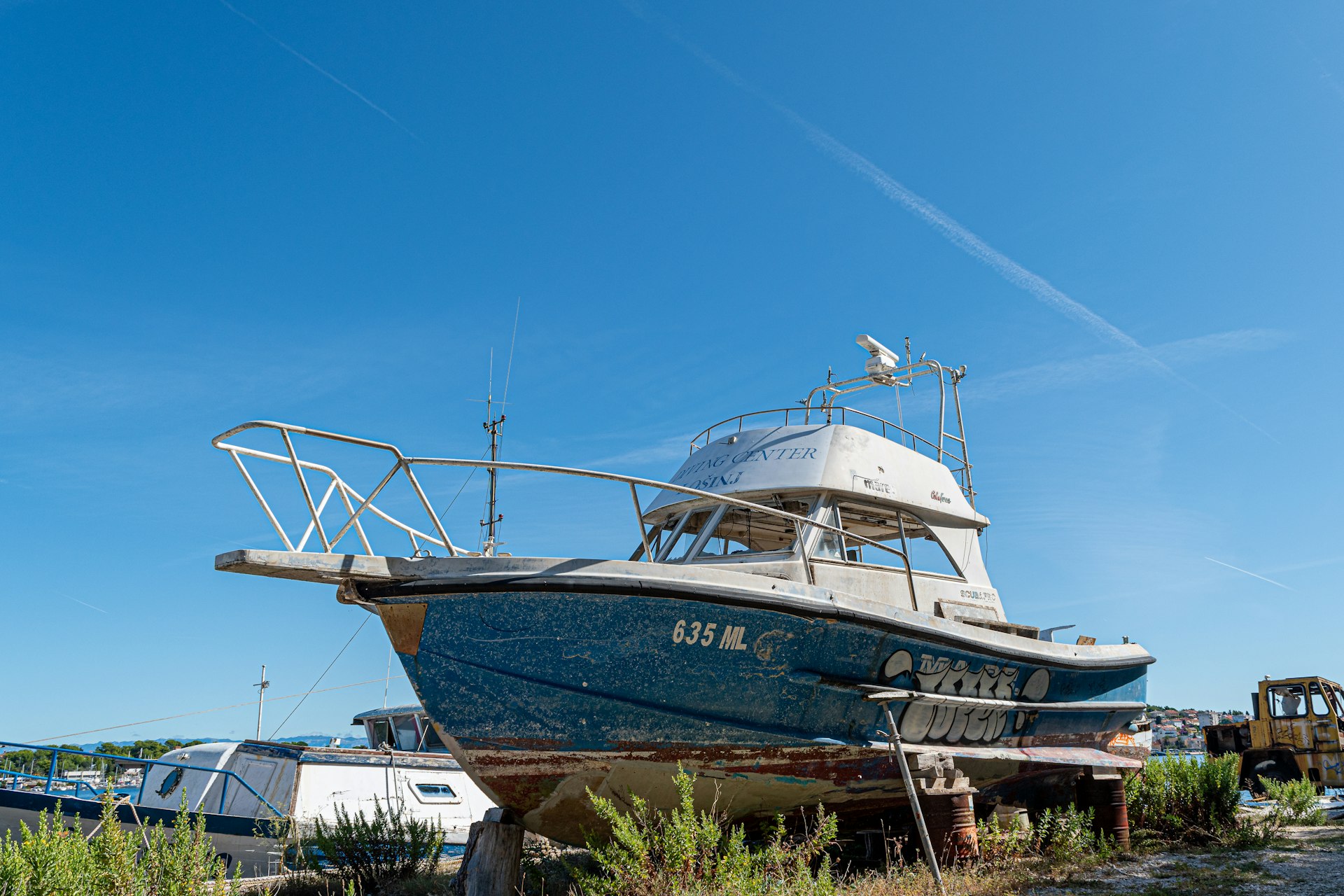 white and brown boat on sea dock during daytime